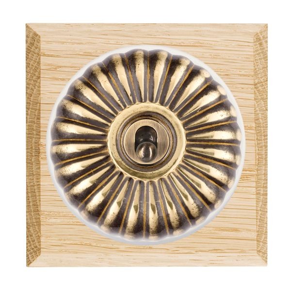 Hamilton Bloomsbury Chamfered Light Oak 1 Gang 20AX Intermediate Toggle Switch with Antique Brass Fluted Dome and White Collar