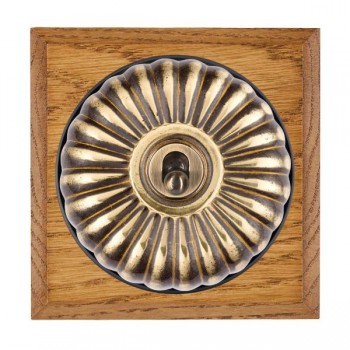 Hamilton Bloomsbury Chamfered Medium Oak 1 Gang 20AX Intermediate Toggle Switch with Antique Brass Fluted Dome and Black Collar