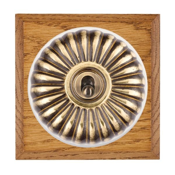 Hamilton Bloomsbury Chamfered Medium Oak 1 Gang 20AX Intermediate Toggle Switch with Antique Brass Fluted Dome and White Collar