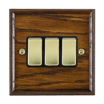 Hamilton Woods Ovolo Dark Oak 3 Gang 10AX 2 Way Switch with Polished Brass Rockers and Black Surround