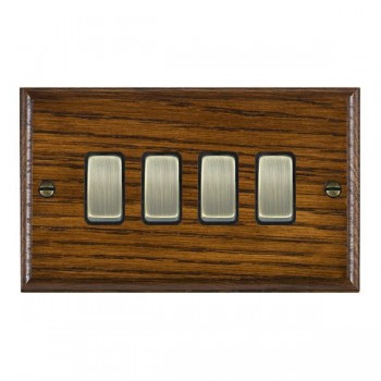 Hamilton Woods Ovolo Dark Oak 4 Gang 10AX 2 Way Switch with Antique Brass Rockers and Black Surround