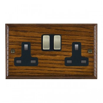 Hamilton Woods Ovolo Dark Oak 2 Gang 13A Double Pole Switched Socket with Antique Brass Rockers and Black Surround