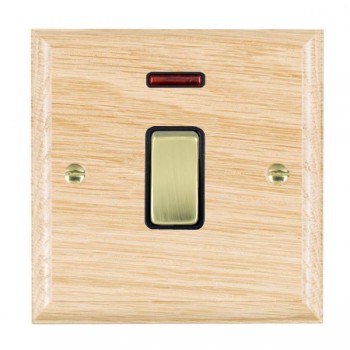 Hamilton Woods Ovolo Light Oak 1 Gang 20AX Double Pole Switch and Neon with Polished Brass Rocker and Black Surround