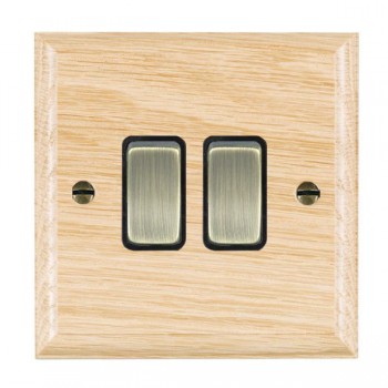 Hamilton Woods Ovolo Light Oak 2 Gang 10AX 2 Way Switch with Antique Brass Rockers and Black Surround