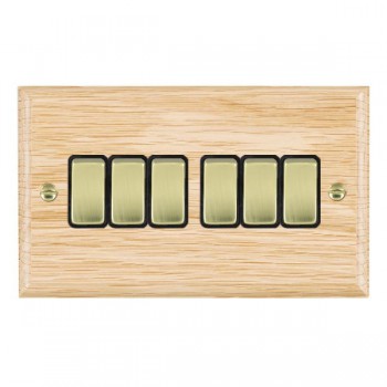 Hamilton Woods Ovolo Light Oak 6 Gang 10AX 2 Way Switch with Polished Brass Rockers and Black Surround