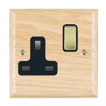 Hamilton Woods Ovolo Light Oak 1 Gang 13A Double Pole Switched Socket with Polished Brass Rocker and Black Surround