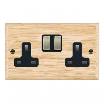 Hamilton Woods Ovolo Light Oak 2 Gang 13A Double Pole Switched Socket with Antique Brass Rockers and Black Surround