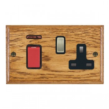 Hamilton Woods Ovolo Medium Oak 45A Double Pole Switch with Red Rocker and Neon plus 13A Switched Socket with Antique Brass Rocker and Black Surround