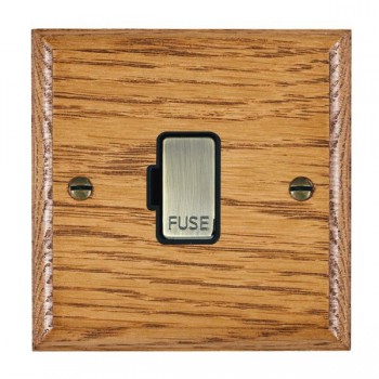 Hamilton Woods Ovolo Medium Oak 13A Unswitched Fused Spur with Antique Brass Insert and Black Surround