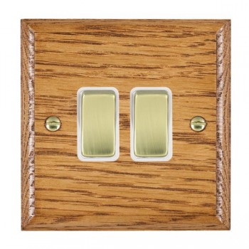 Hamilton Woods Ovolo Medium Oak 2 Gang 10AX 2 Way Switch with Polished Brass Rockers and White Surround