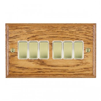 Hamilton Woods Ovolo Medium Oak 6 Gang 10AX 2 Way Switch with Polished Brass Rockers and White Surround