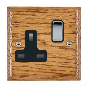 Hamilton Woods Ovolo Medium Oak 1 Gang 13A Double Pole Switched Socket with Bright Chrome Rocker and Black Surround