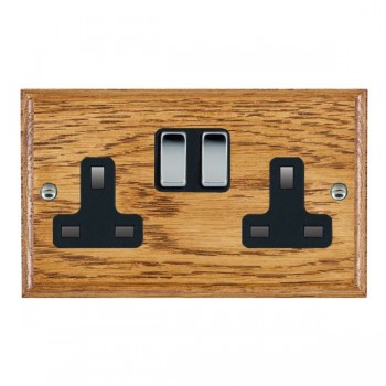 Hamilton Woods Ovolo Medium Oak 2 Gang 13A Double Pole Switched Socket with Bright Chrome Rockers and Black Surround