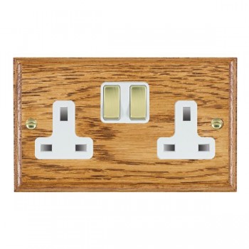 Hamilton Woods Ovolo Medium Oak 2 Gang 13A Double Pole Switched Socket with Polished Brass Rockers and White Surround