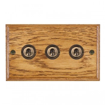 Hamilton Woods Ovolo Medium Oak 3 Gang 20AX 2 Way Toggle Switch with Antique Brass Toggles